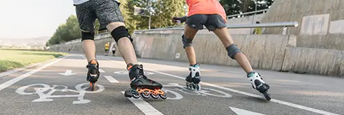 Mum and kids skating in the park 