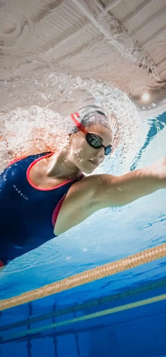 Woman swimming in swimming pool