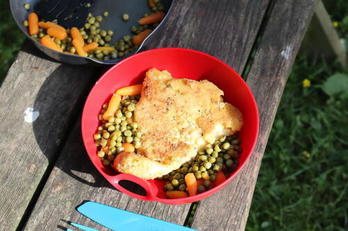 Breaded fish with peas and carrots