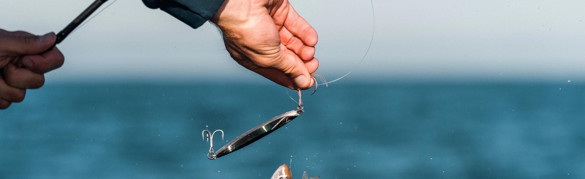 Man with fish on rod