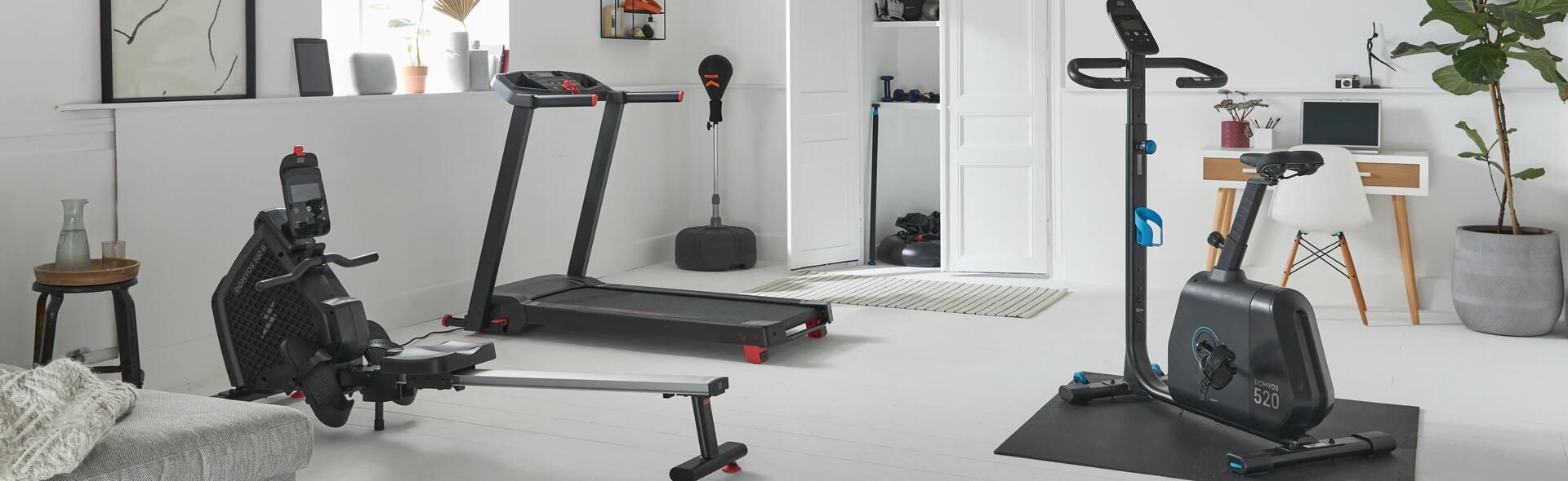 Home-gym setup featuring treadmill, rowing machine and more