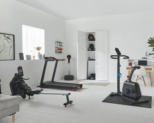 Home-gym setup featuring treadmill, rowing machine and more