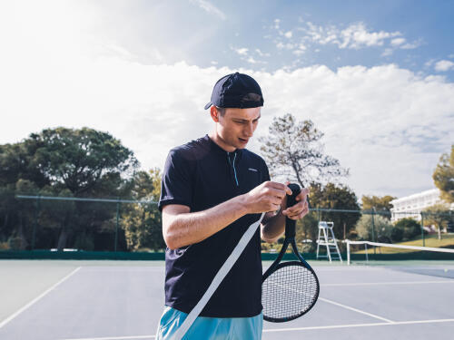 Fitting a tennis racket grip or overgrip