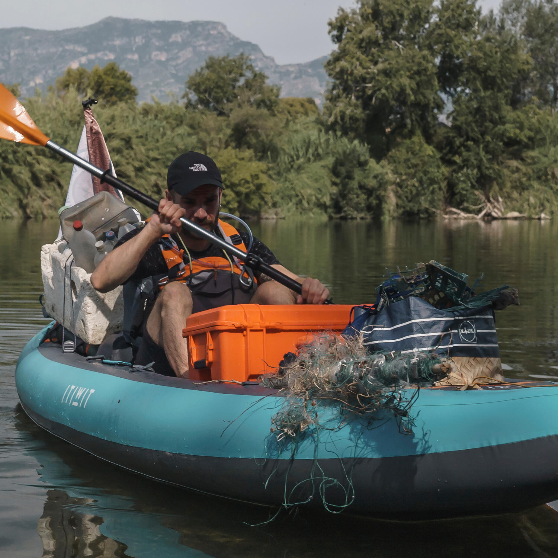 two people fishing in a tandem kayak