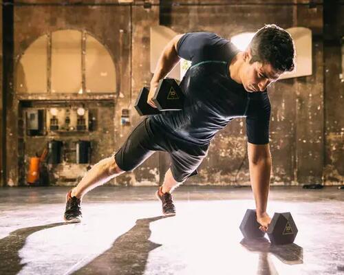man training with dumbbells