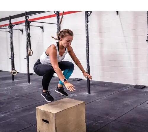 Woman jumping on box