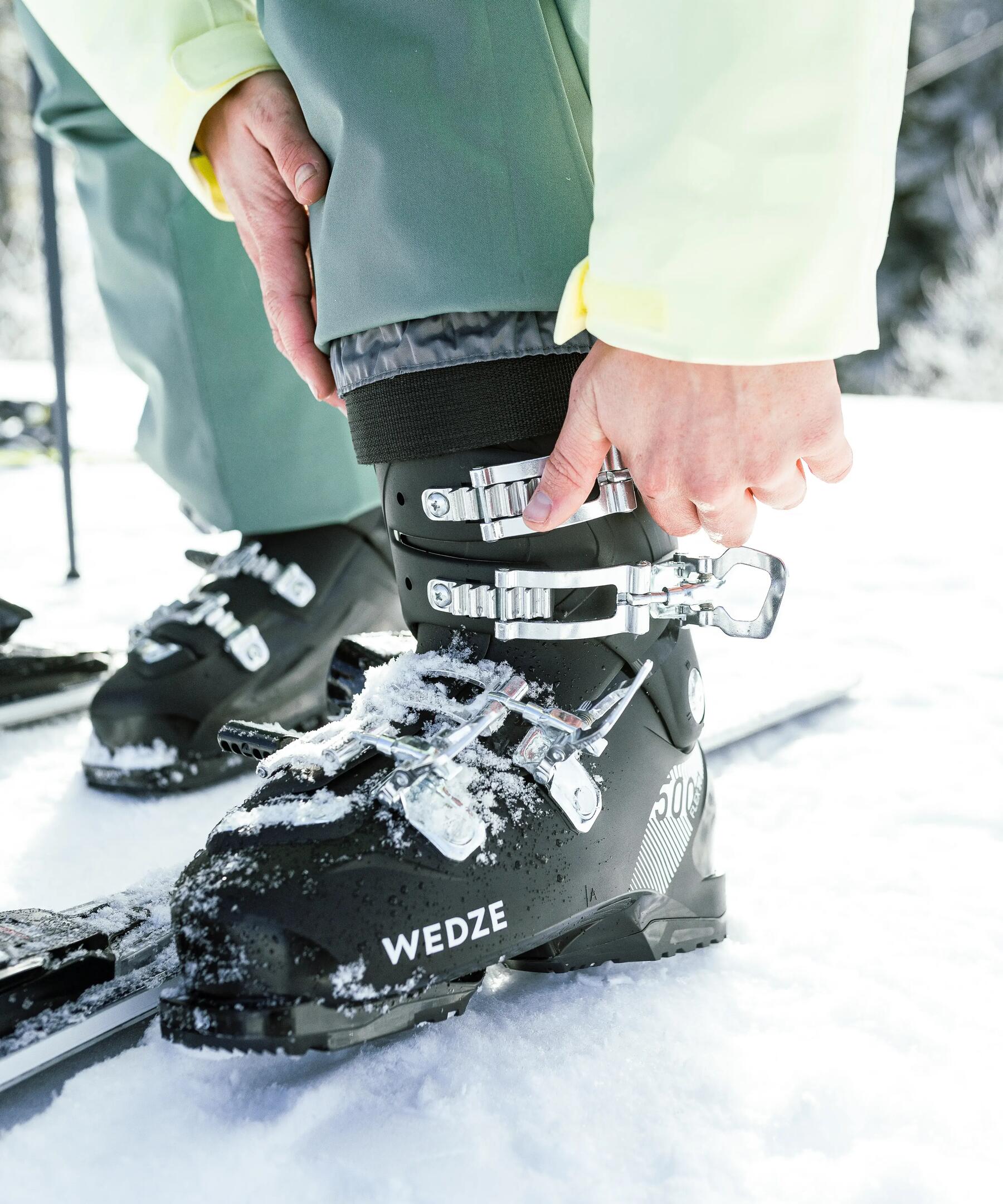 close up of skier closing their ski boot