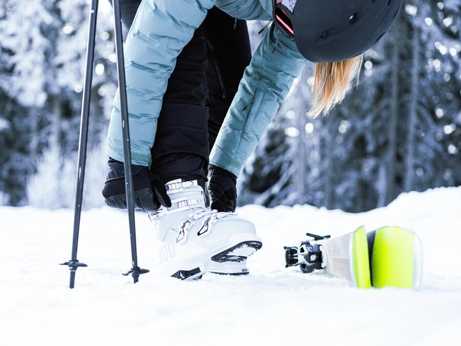 lady adjusting her ski boot