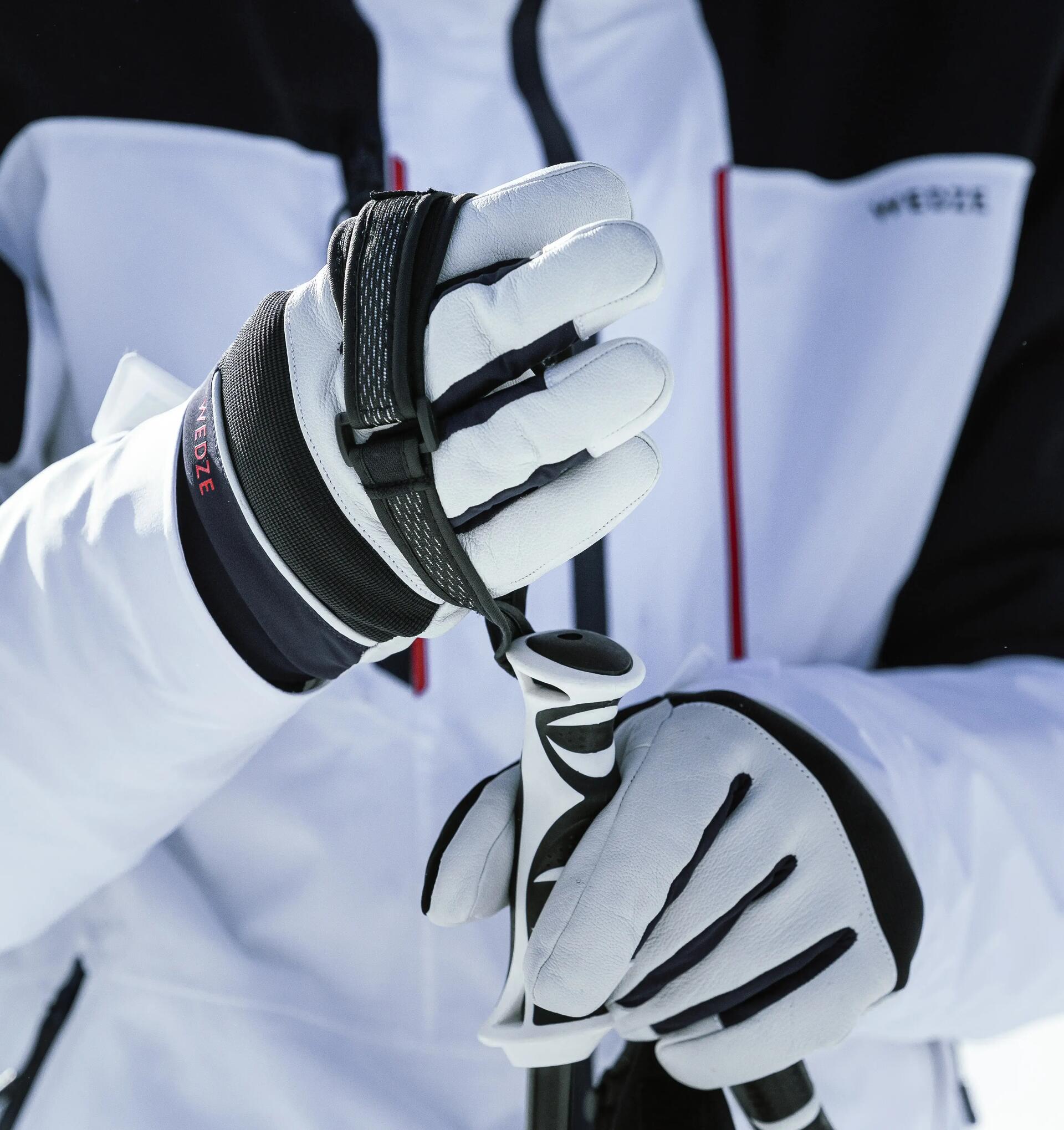 a close up of white ski gloves