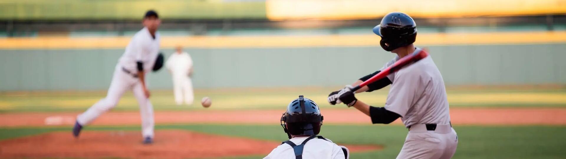 people playing baseball on a baseball field