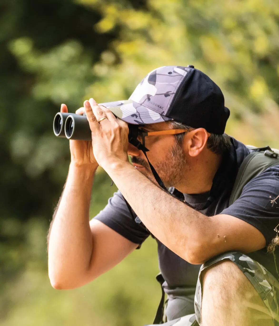 Man looking through binoculars