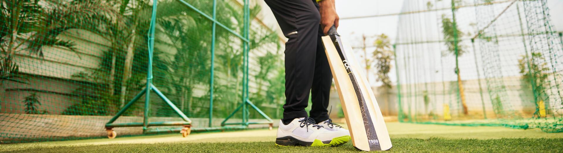focus on man holding a cricket bat