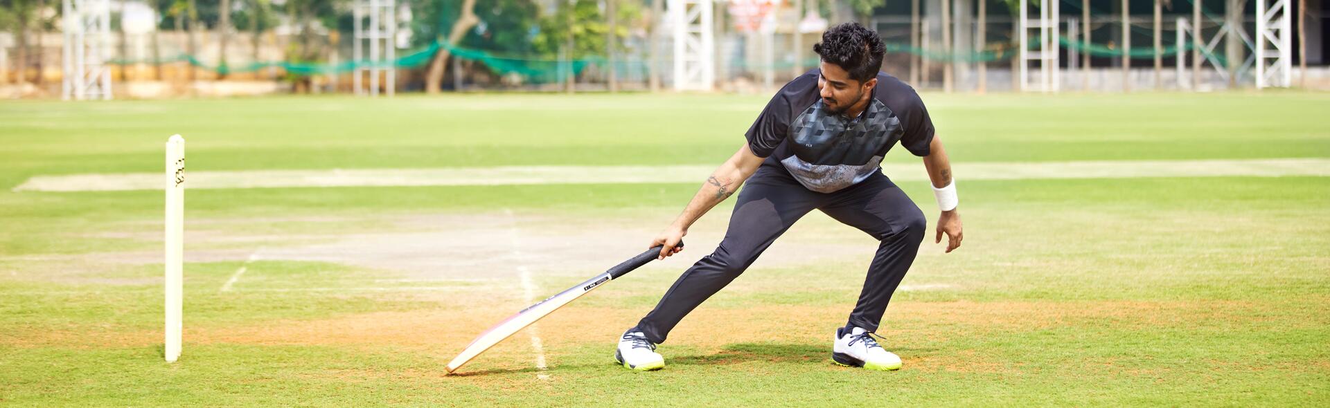 man playing cricket