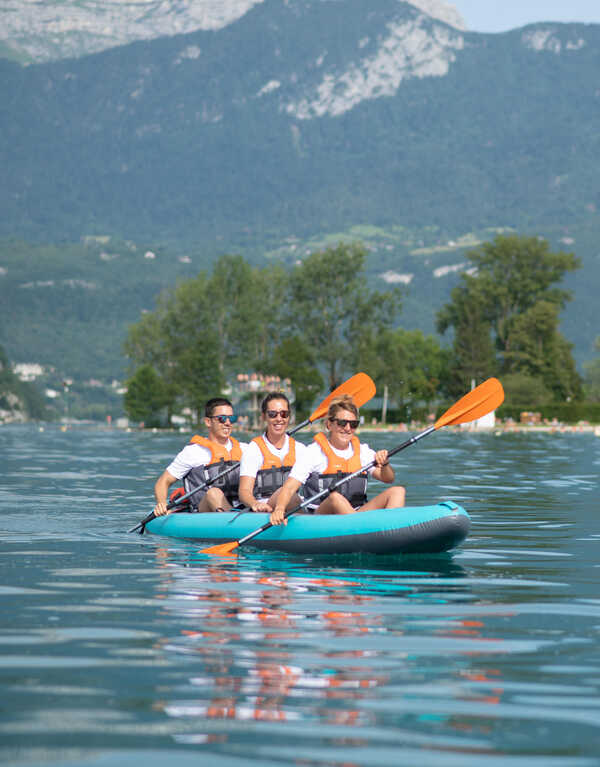 Three persons in a kayak