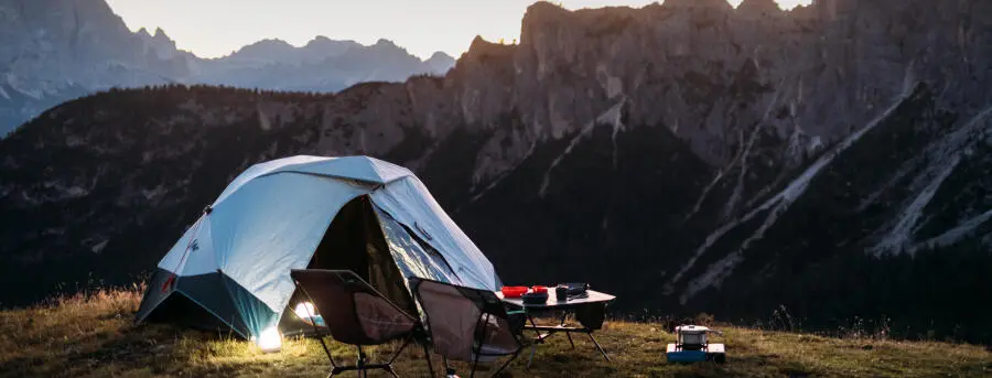 Image of man and tent at night