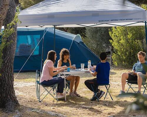 Couple eating at campsite