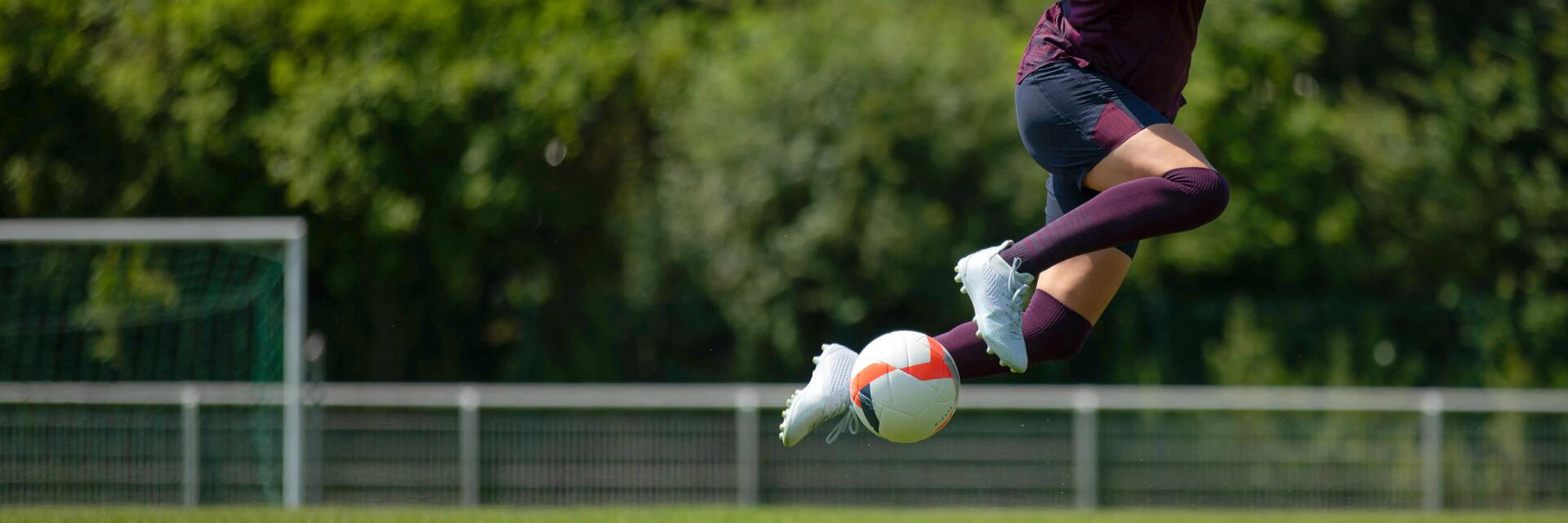 Woman doing a football kick
