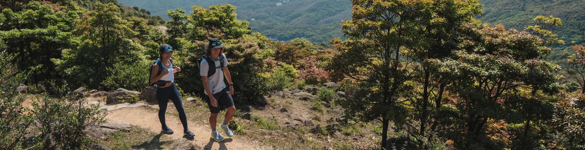 Two teens, a girl and boy taking a hike.