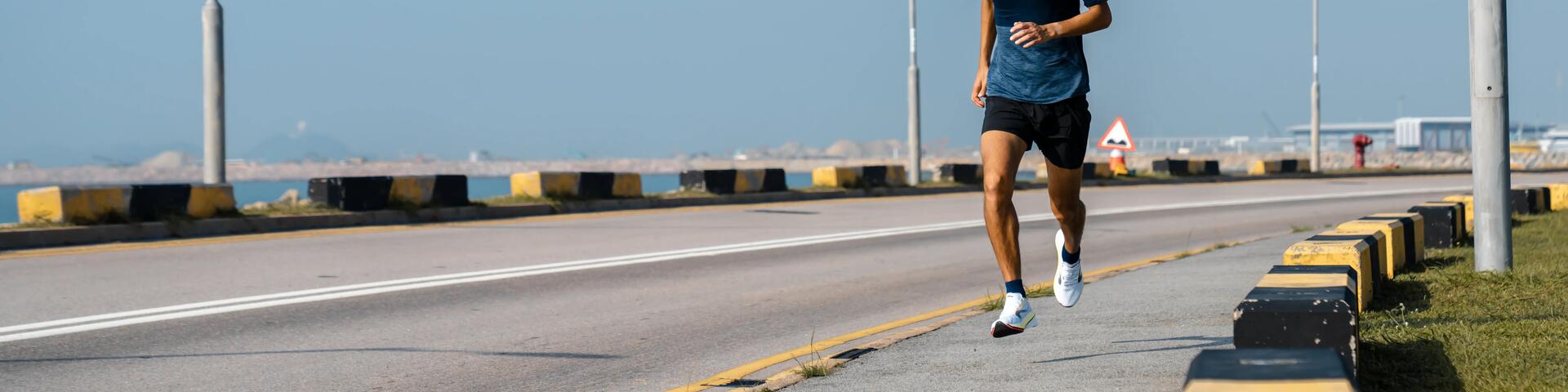Close-up of man running on street