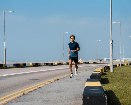 Close-up of man running on street
