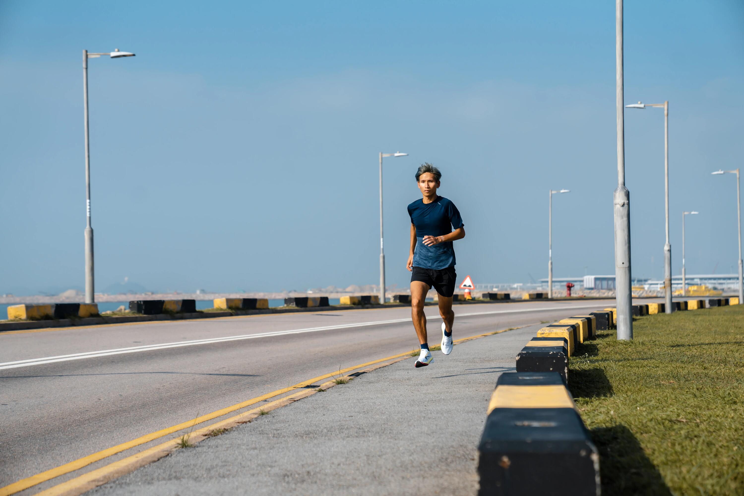 Close-up of man running on street