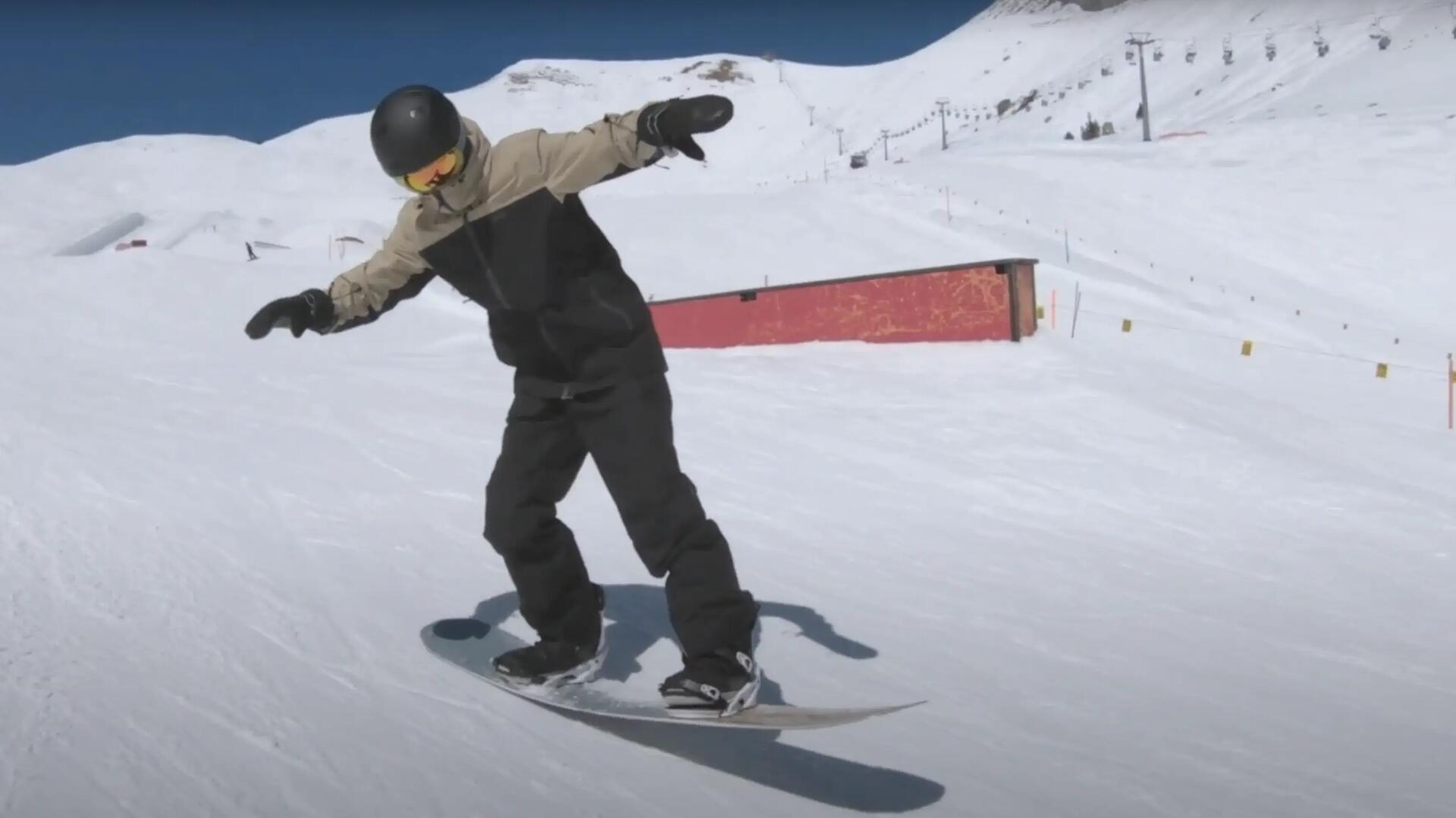 hombre haciendo un ollie en snowboard
