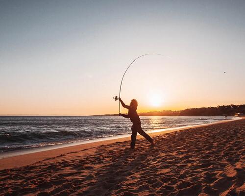 Man fishing in the beach