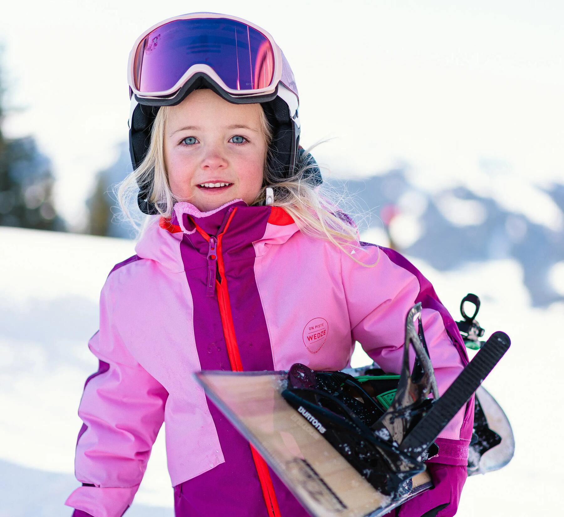young girl snowboarding