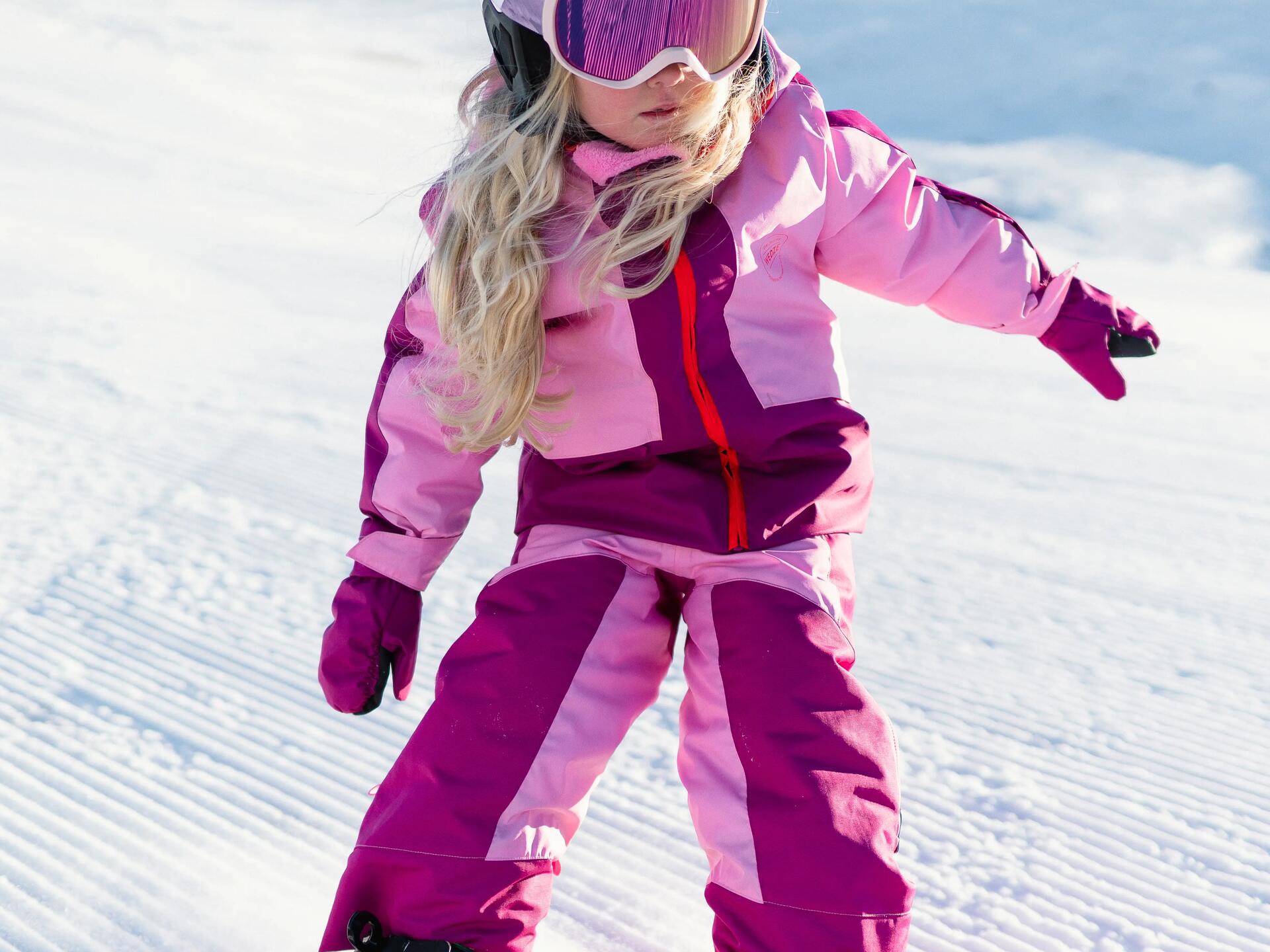 child snowboarding