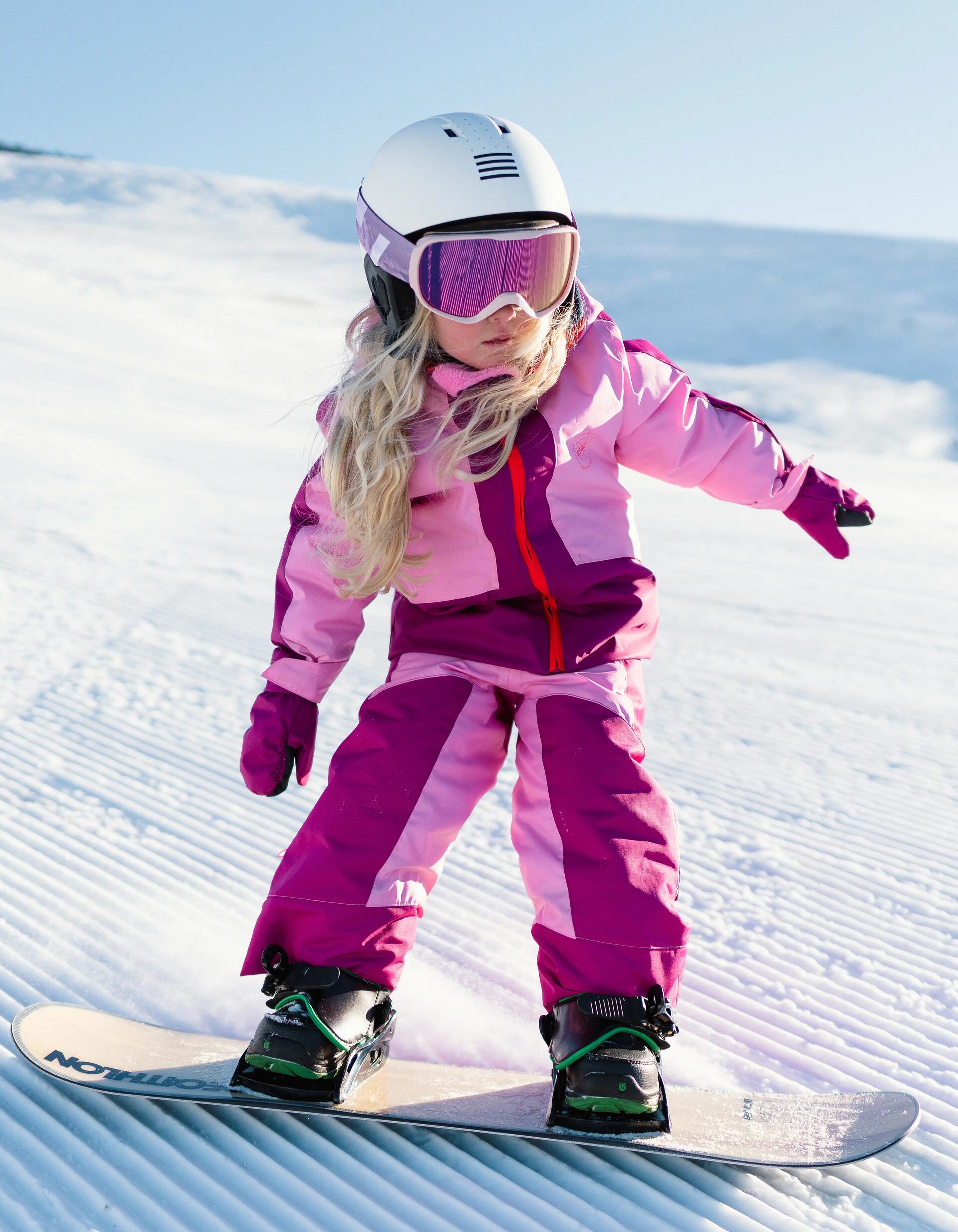 child snowboarding