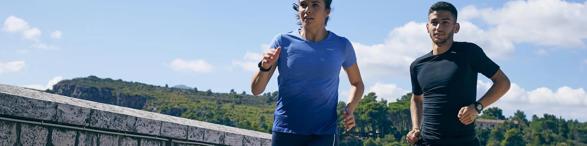 Man and woman running outdoors