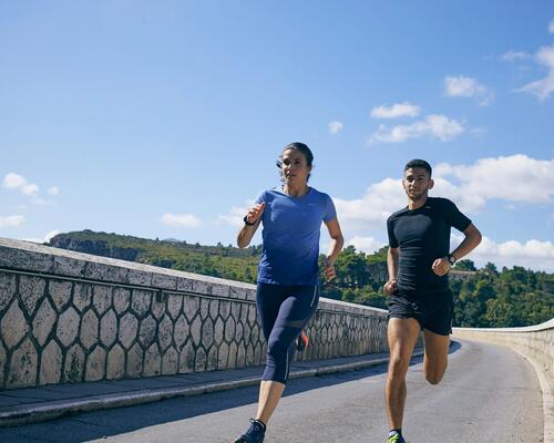 Man and woman running outdoors