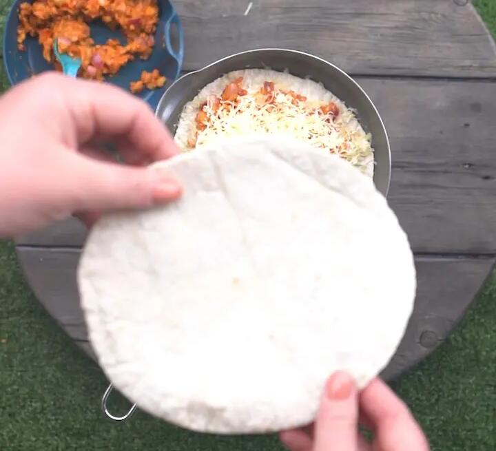 Placing another tortilla on top