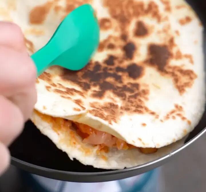 Frying the quesadilla on both sides